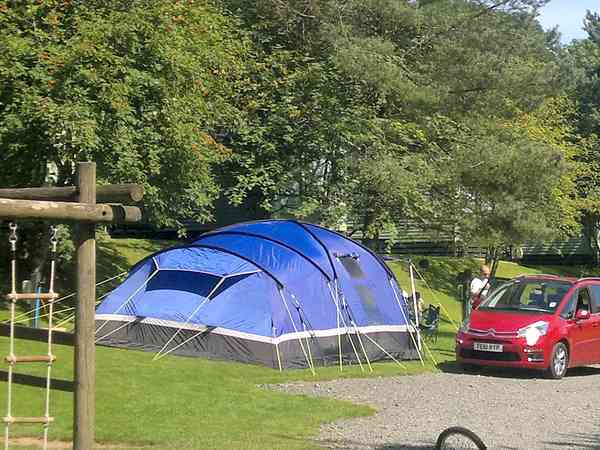 Fully-serviced grass tent pitch