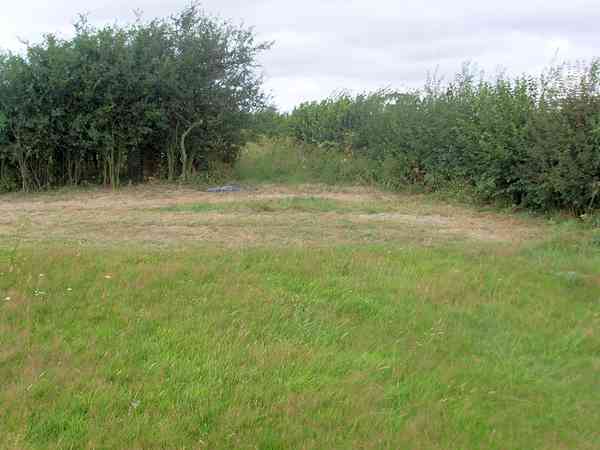 Red non-electric grass tent pitch