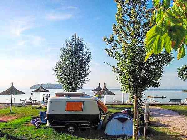 Electric hardstanding and grass touring caravan pitch