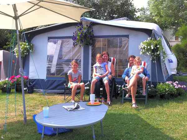 Fully-serviced grass trailer tent or touring caravan pitch