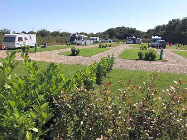 Powered cement/asphalt and grass travel trailer site