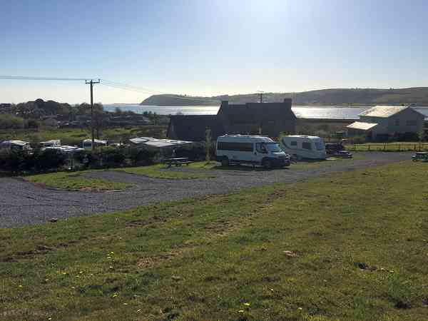 Electric hardstanding and grass motorhome pitch (sea view)