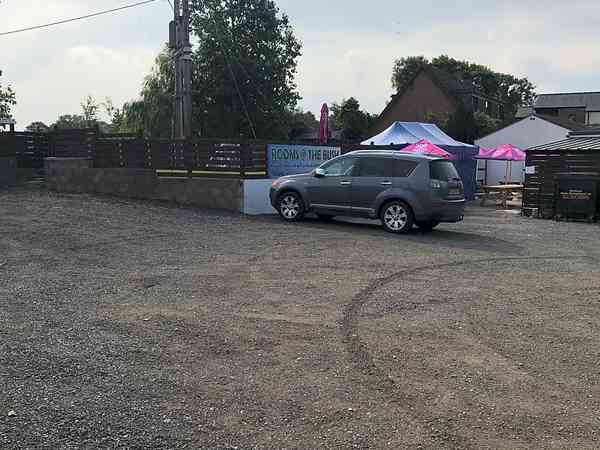 Primitive gravel and cement/asphalt RV site