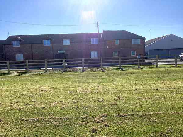 Powered grass travel trailer site