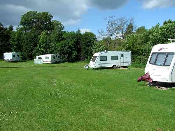 Powered grass trailer site