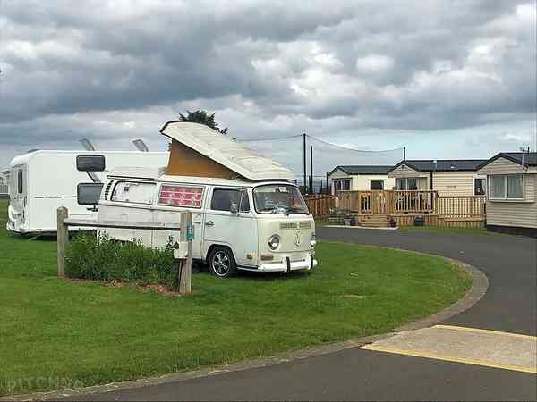Powered grass travel trailer site