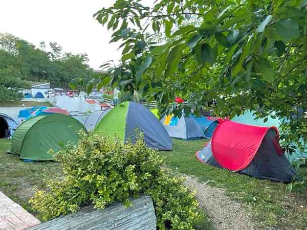 Powered grass and earth tent site