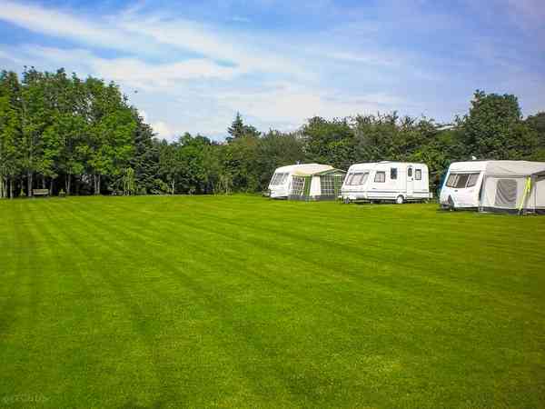 Fully-serviced grass touring caravan pitch
