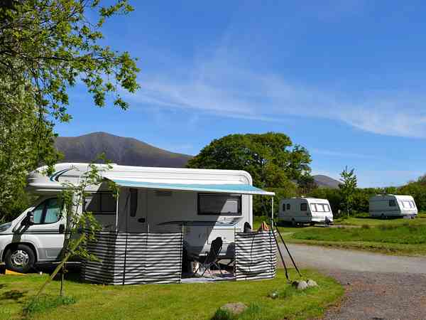 Spacious hardstanding and grass pitch Spacious hardstanding and grass pitch