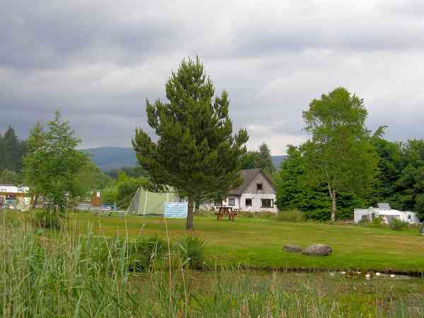 View of the tent area from the far side of the pond View of the tent area from the far side of the pond