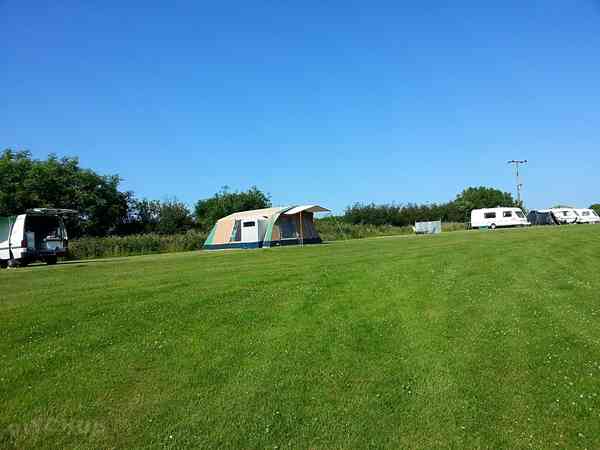 Non-electric grass tent pitch (sloping, no pets, two man)