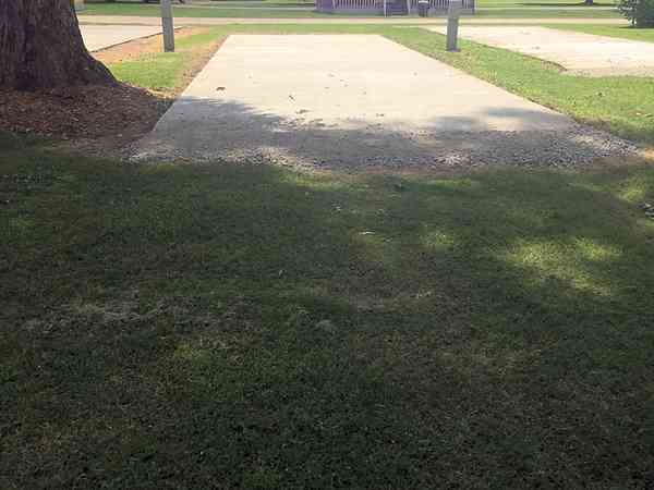 FHU cement/asphalt and grass travel trailer site