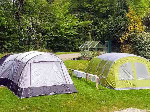 Powered grass tent or trailer tent site