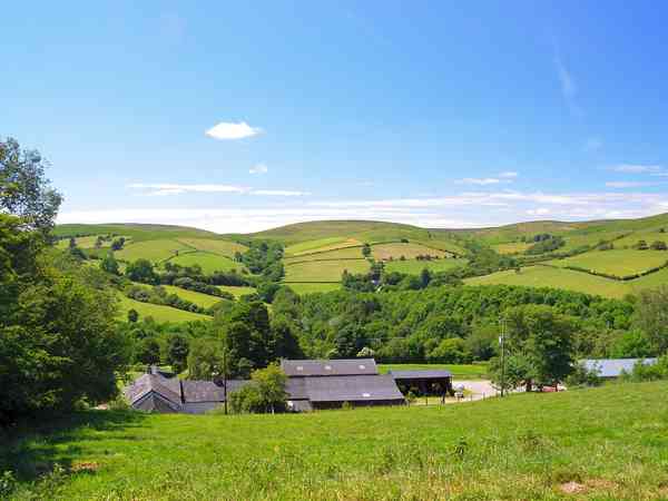View across the farm to hills beyond View across the farm to hills beyond