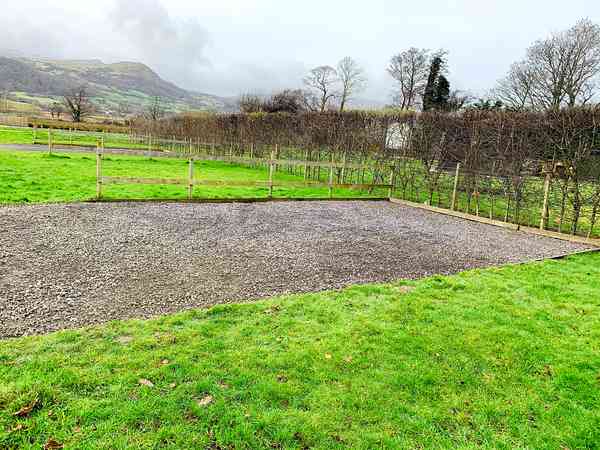 Electric hardstanding and grass touring pitch