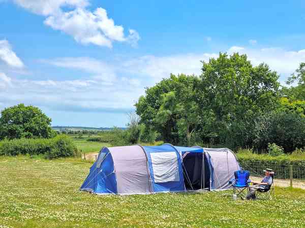 Primitive grass tent or trailer tent site