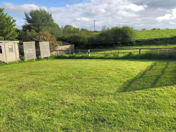 Powered grass tent or trailer tent site