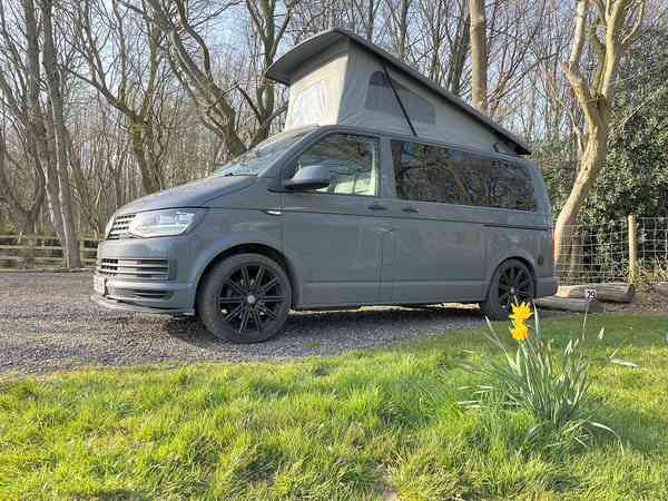 Powered gravel and cement/asphalt travel trailer site