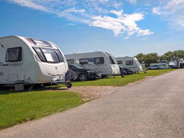 Electric cement/asphalt and grass touring pitch (ensuite)