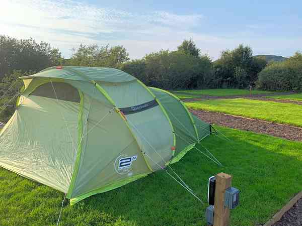 Electric grass tent pitch