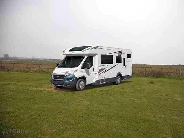 Electric optional grass and earth motorhome pitch