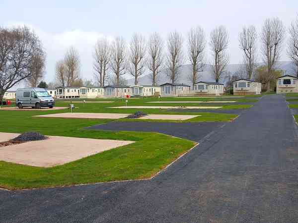 Electric hardstanding and grass touring pitch