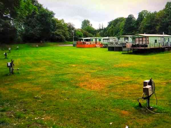 Unpowered concrete and grass site