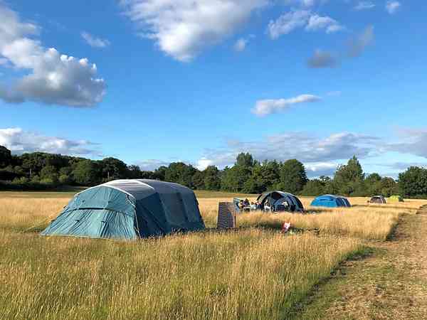 Non-electric grass and earth tent pitch