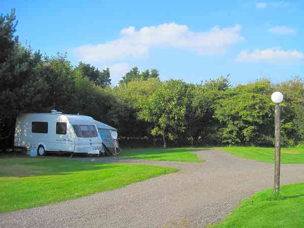 Hardstanding with grass Hardstanding with grass