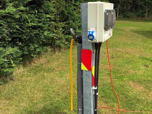Electric optional grass touring caravan pitch