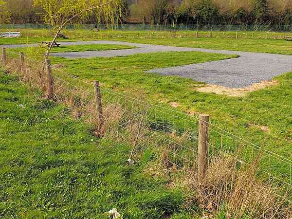 Powered cement/asphalt and grass trailer site
