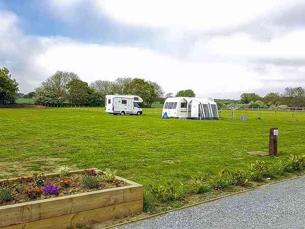 Electric grass and gravel touring pitch