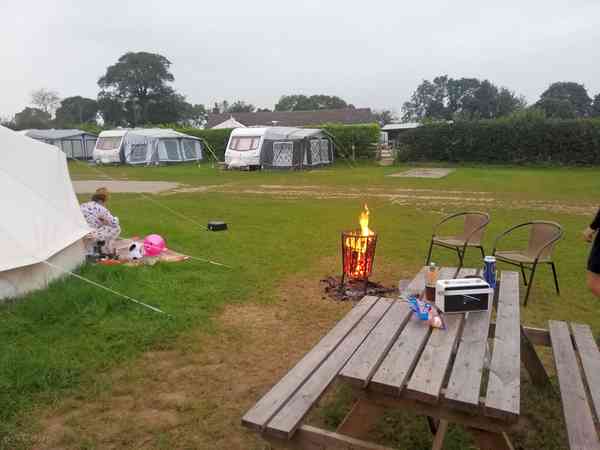 Electric asphalt and grass touring caravan pitch (2 adults and 2 children)