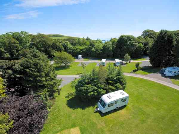 Electric hardstanding and grass touring pitch