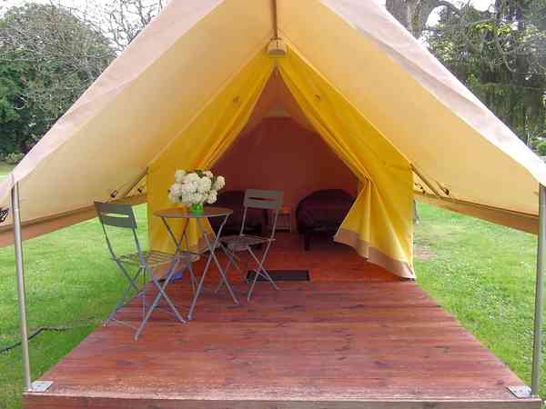 The tent comes with an awning and outdoor furniture The tent comes with an awning and outdoor furniture