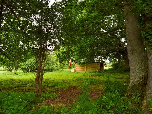 Power optional concrete and grass tent or trailer tent site