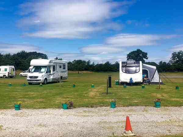 Power optional cement/asphalt and grass travel trailer site