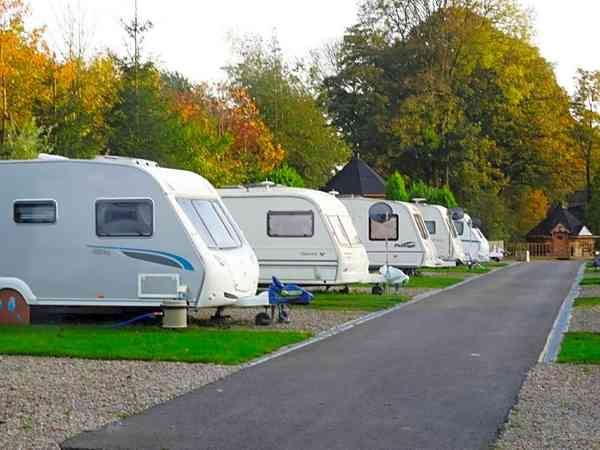 Electric hardstanding and grass touring caravan pitch (no awning)
