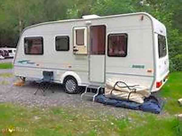 Non-electric grass and earth touring caravan pitch