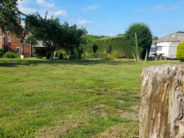 Electric hardstanding and grass pitch