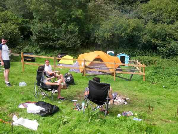 Open log fire next to the tents Open log fire next to the tents