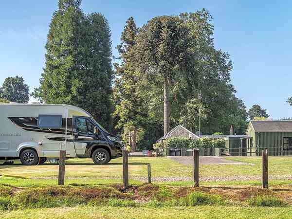 Electric hardstanding and grass touring pitch
