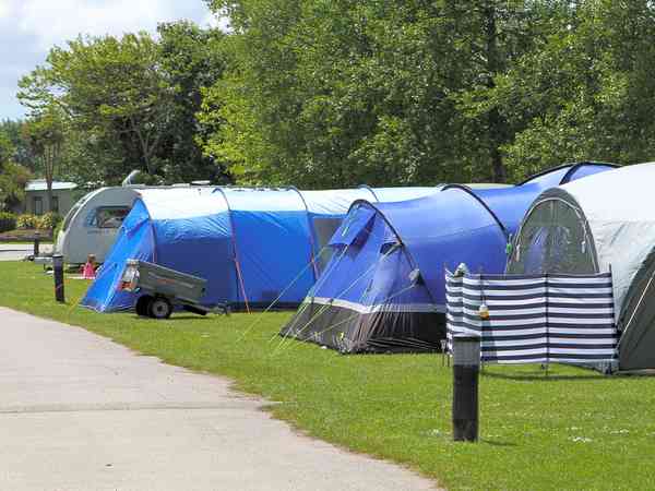 Electric hardstanding and grass pitch (premium)
