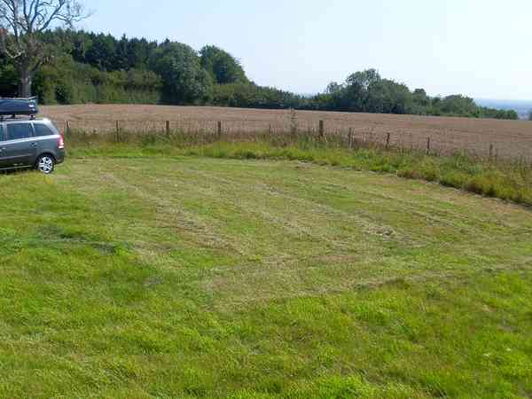 Yellow non-electric grass tent pitch