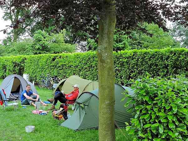 Powered grass tent site