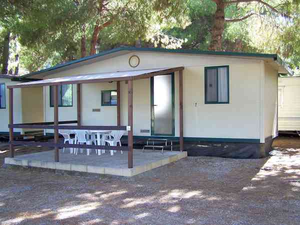 Caravan with deck and outdoor seating Caravan with deck and outdoor seating