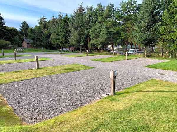 Fully-serviced grass and gravel motorhome pitch (no awning)