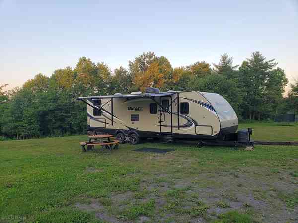 Powered grass and gravel trailer site (back-in)
