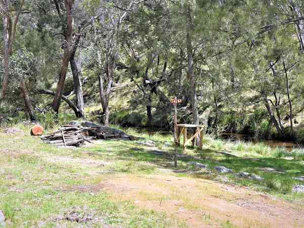 Unpowered grass and earth tent or trailer tent site