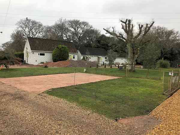 Fully-serviced asphalt and grass pitch (superior)